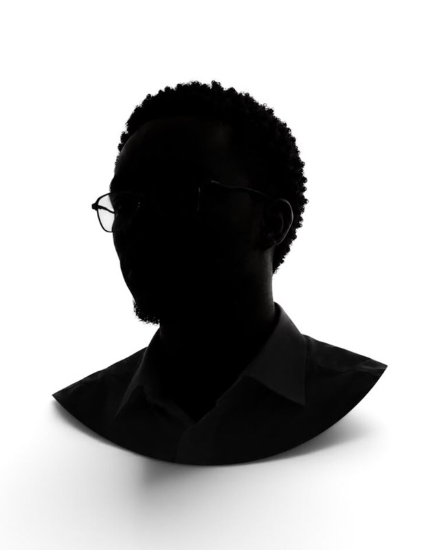 Silhouette portrait of Noah Mawunyo Seddoh wearing glasses